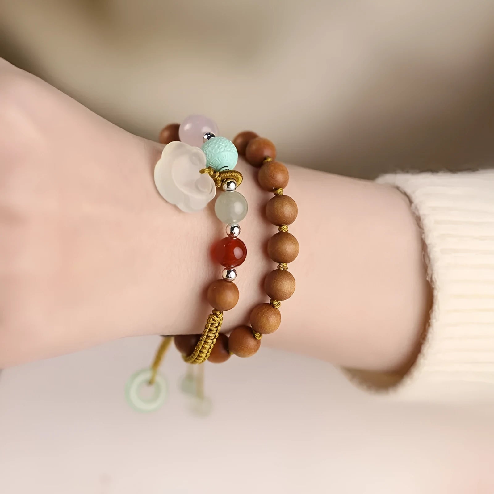 Hand-woven ebony double ring bracelet with ruyi elements in jade or chalcedony colour options