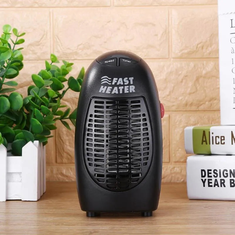 Black mini ceramic electric heater with digital display and rotating plug on a white background