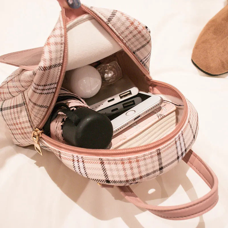 Diagonal one shoulder phone bag in PU leather, shown in a selection of colours.