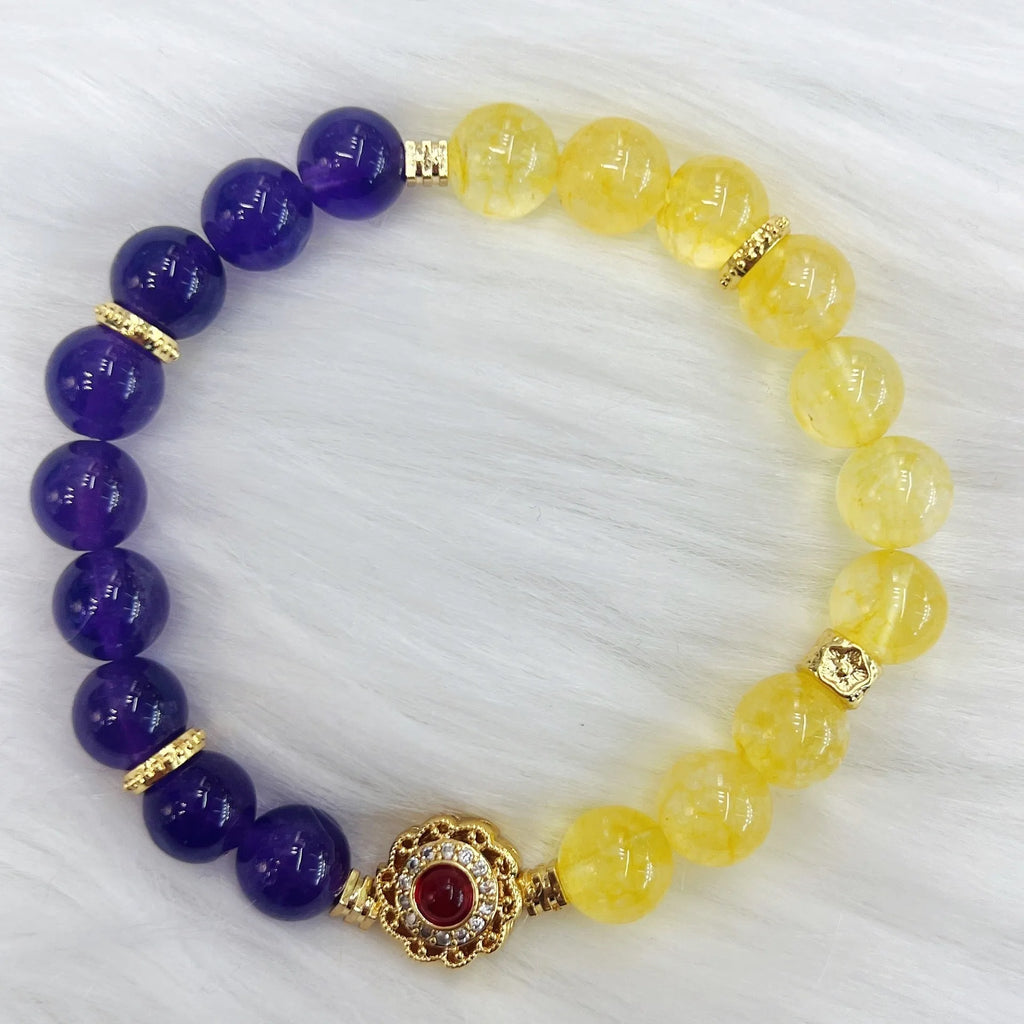 Handmade women's yellow and purple bracelet with amethyst and crystal beads featuring adjustable sliding knot closure