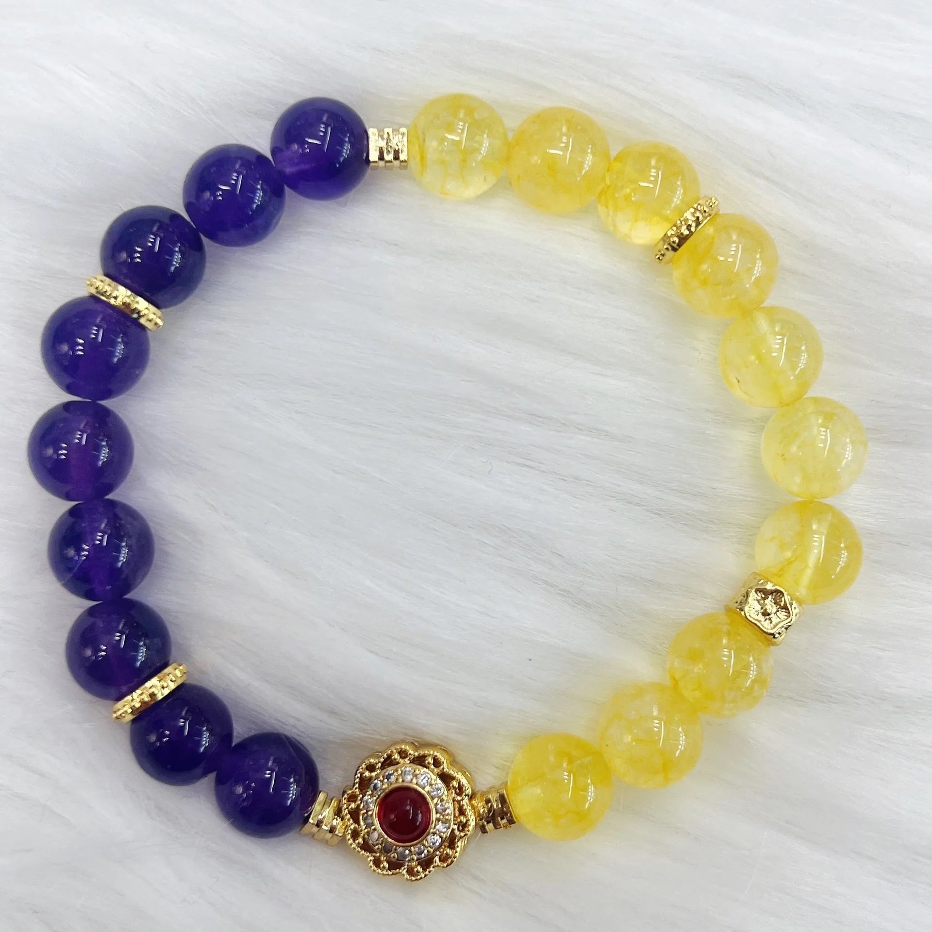 Handmade women's yellow and purple bracelet with amethyst and crystal beads featuring adjustable sliding knot closure
