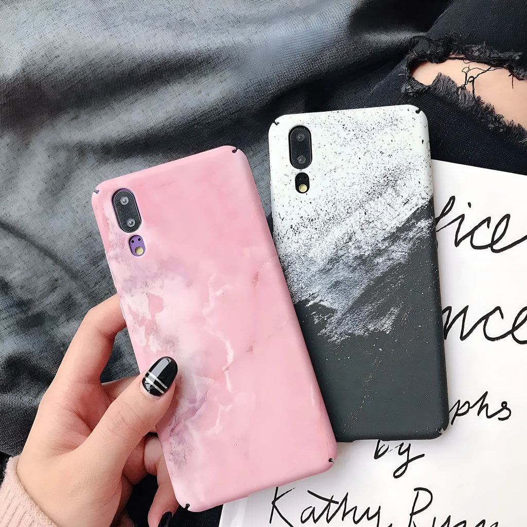 Black painted polycarbonate back cover case for a Huawei smartphone on a white background.