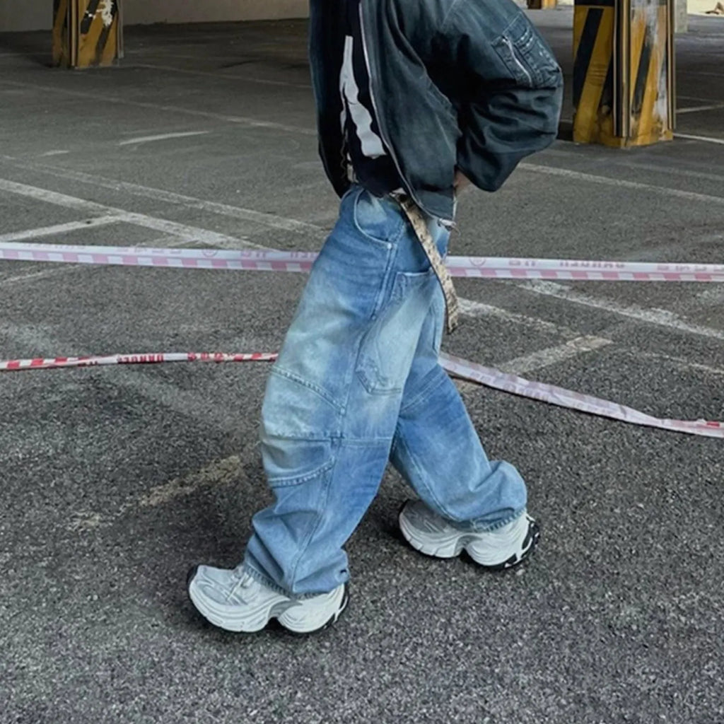 Baggy washed blue straight-leg jeans with zip fly on mannequin