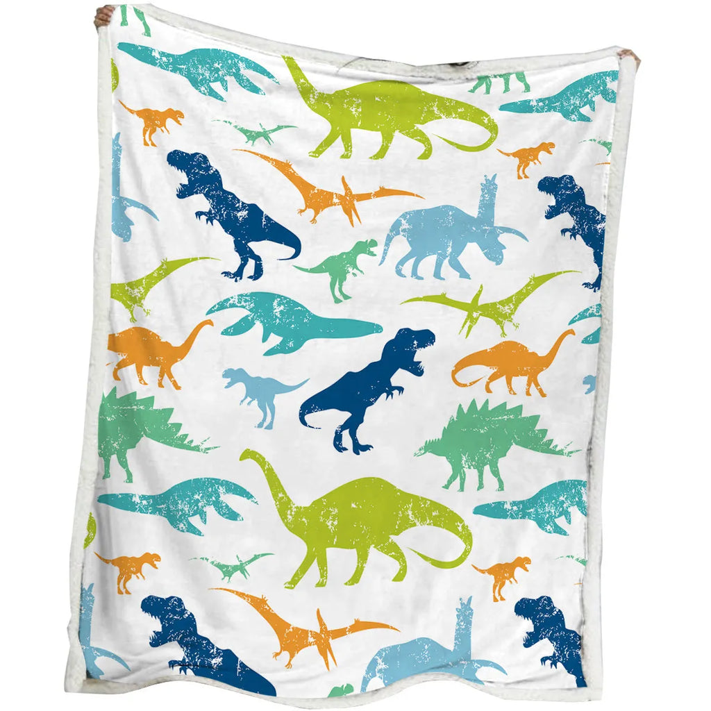 Dinosaur themed lamb wool blanket in white on a sofa, measuring 130x150cm or 150x200cm
