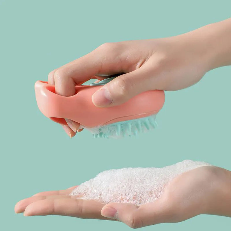 Blue silicone claw pet bath brush for washing cats and dogs on a white background.