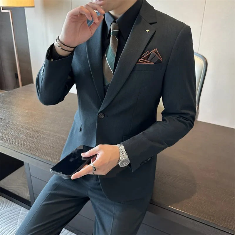 Men's dark green slim fit business suit jacket on a hanger.