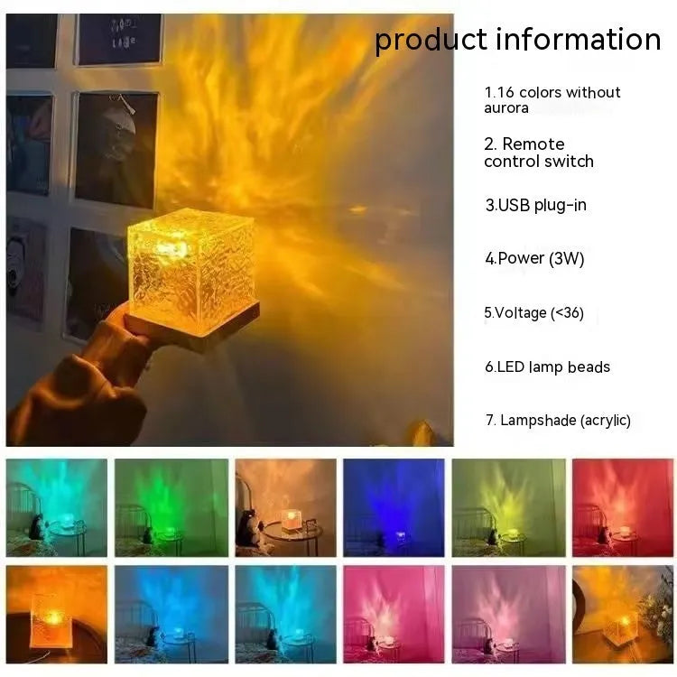 Modern geometric crystal table lamp projecting colourful water ripple light effect on wall.