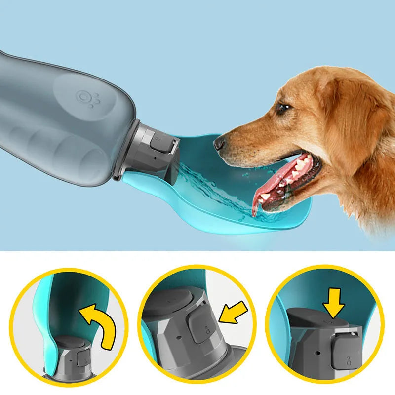 Blue-grey foldable dog water bottle with drinking trough open, showing wrist strap and lock key.