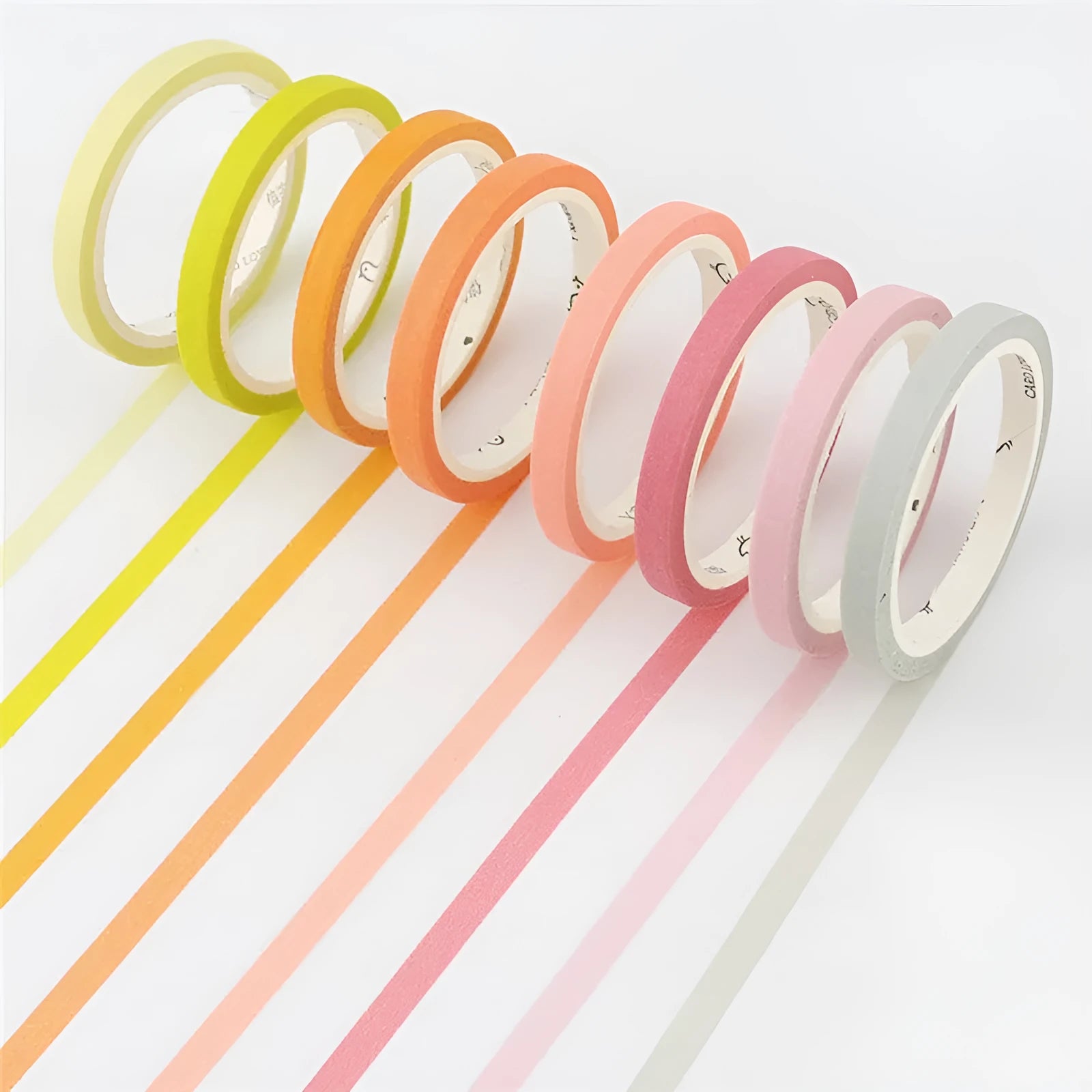 Roll of solid colour paper tape in crimson or deep purple, showing 5mm width stationery tape for organisation