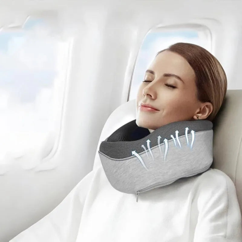 U-shaped memory foam travel neck pillow in navy blue with buckle fastening, shown rolled with carry bag
