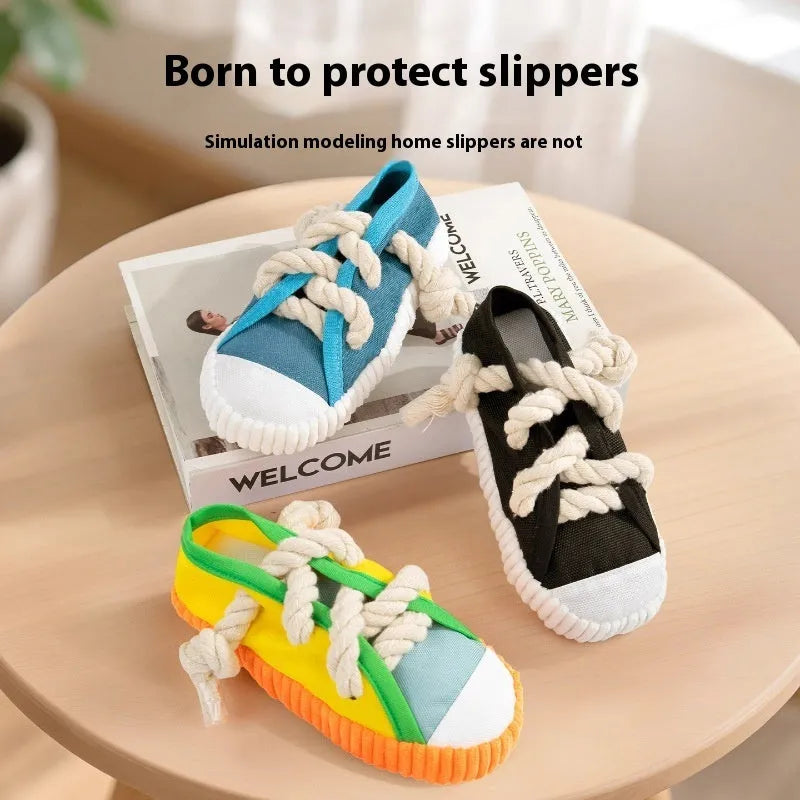 Yellow plastic dog slipper chew toy with a self-hi sound feature for biting.