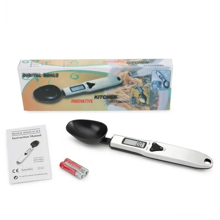Smart digital measuring spoon with LCD display showing weight, used as a kitchen scale for food ingredients.