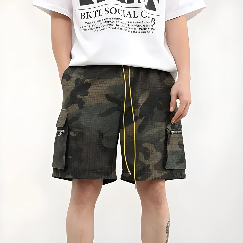 Men's camouflage multi-pocket cropped work shorts laid flat showing cargo pockets and camo pattern.
