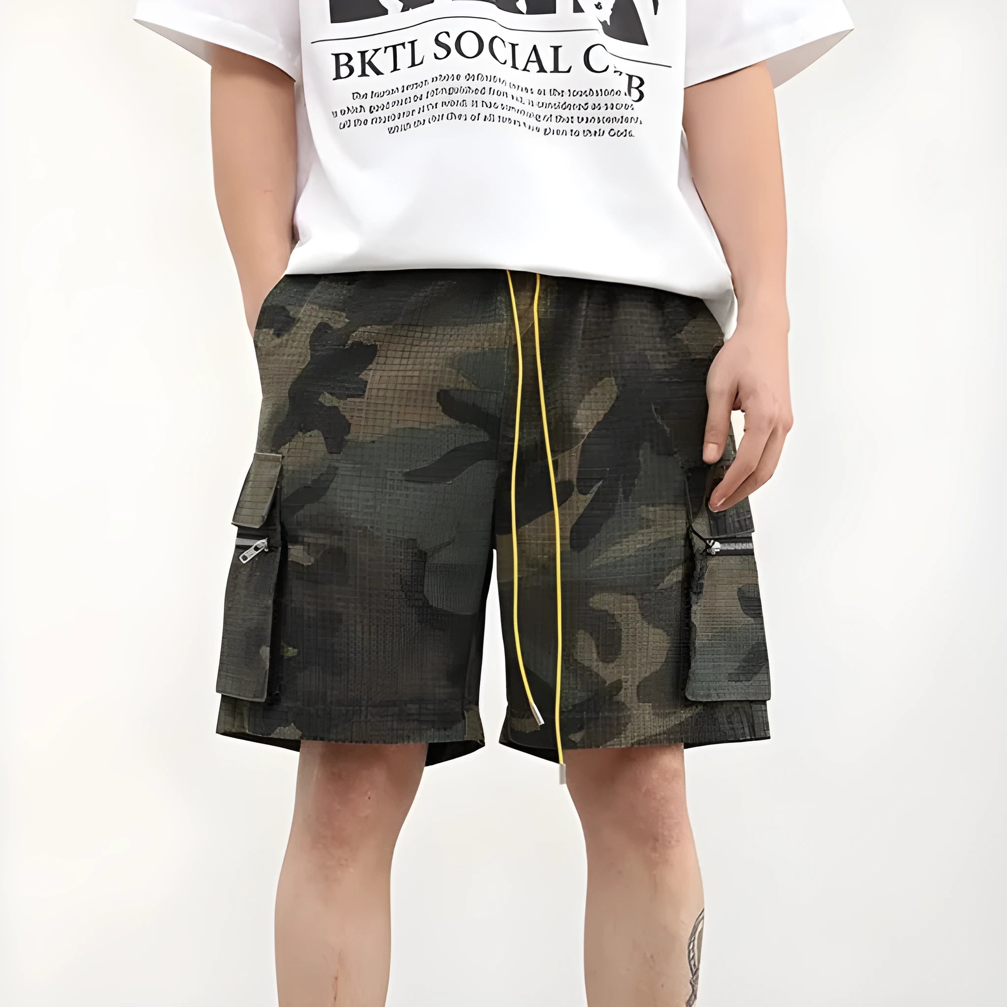 Men's camouflage multi-pocket cropped work shorts laid flat showing cargo pockets and camo pattern.