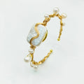 Natural freshwater pearl handmade wire-wrapped bracelet in gold titanium steel on wrist