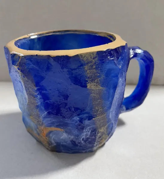 Purple resin mineral crystal coffee mug with handle showing 3D texture and 10cm height