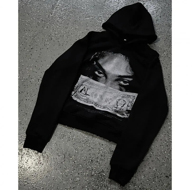 Women's black hoodie with a cartoon pattern print, loose fit.