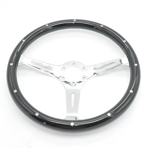 Black classic car steering wheel made from peach wood with a bright electroplated finish, showing six-hole bolt pattern.