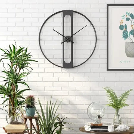 50cm round metal wall clock in black or gold finish on a wall