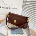 Brown French style casual underarm bag with a single shoulder chain, showing sandwich pocket and sewing thread detail.