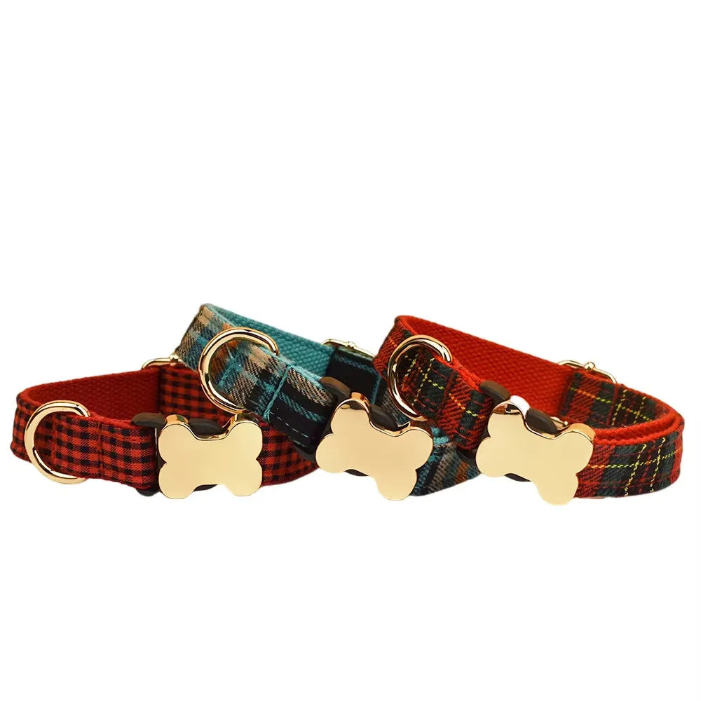 Nylon dog collar with printed grid pattern and a large bone-shaped metal buckle.