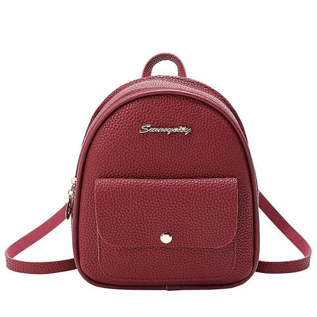 A compact black PU women's backpack purse with a zipper, shown as a small shoulder bag.