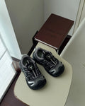 Girls' casual shoes with PU leather mesh upper in black, beige or pink colours on solid background