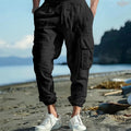 Men's ankle-tied linen trousers in Army Green colour showing multi-pocket design and drawstring waist
