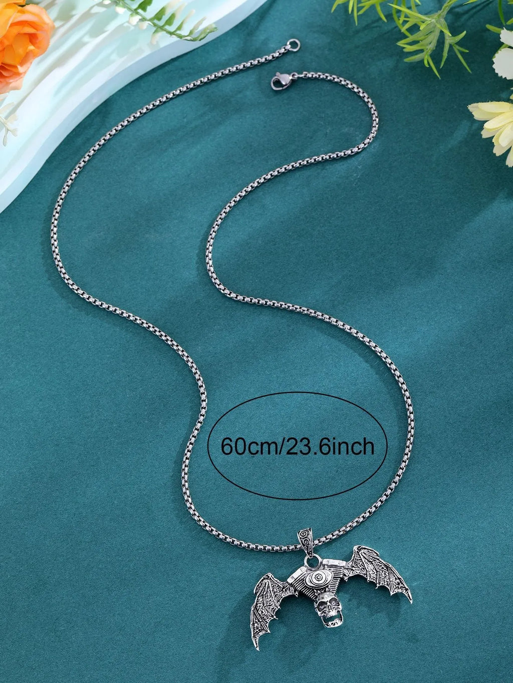 Gothic dark skull alloy necklace with skeleton wing pendant on display