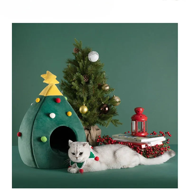 Red Christmas tree shaped plush cave bed for cats and small dogs on a wooden floor.