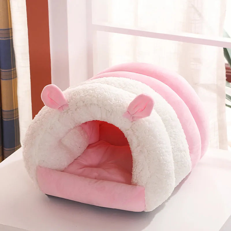 Blue enclosed cat nest with fluffy fleece interior, shown with a removable washable cover.