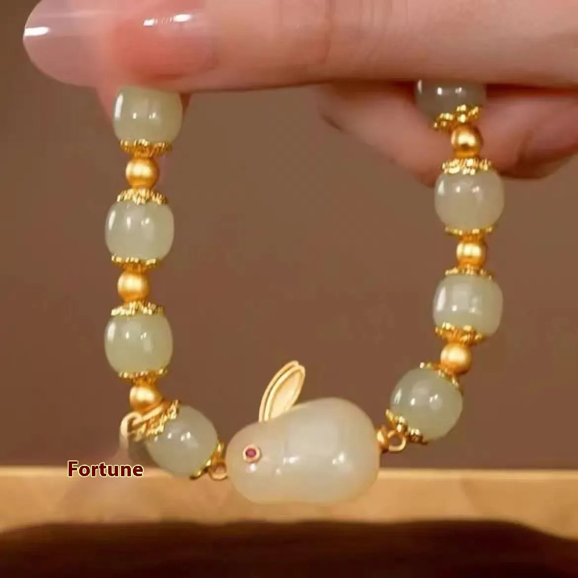 Green jade hare bracelet with Chinese zodiac design and electroplated finish