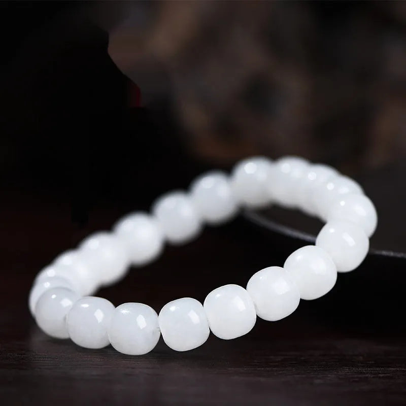 White Hetian jade barrel bead bracelet showing three size options: 5x6mm, 7x8mm, and 8x10mm on a neutral background.