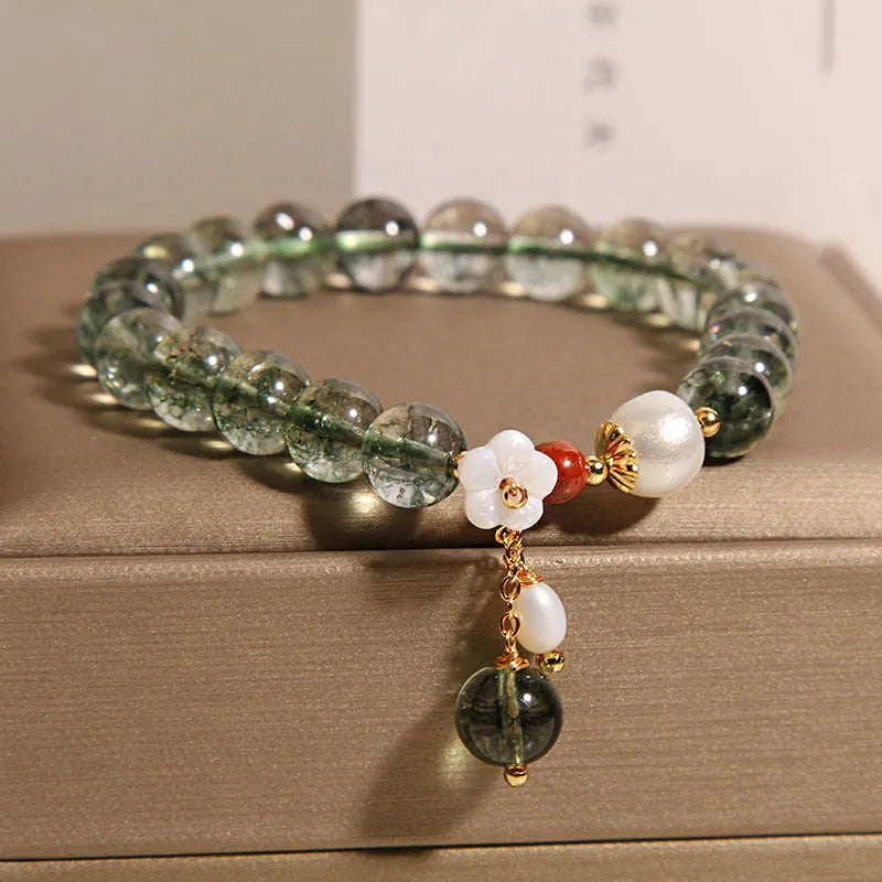 Green phantom quartz crystal bracelet with shell flower and Bells of Ireland design