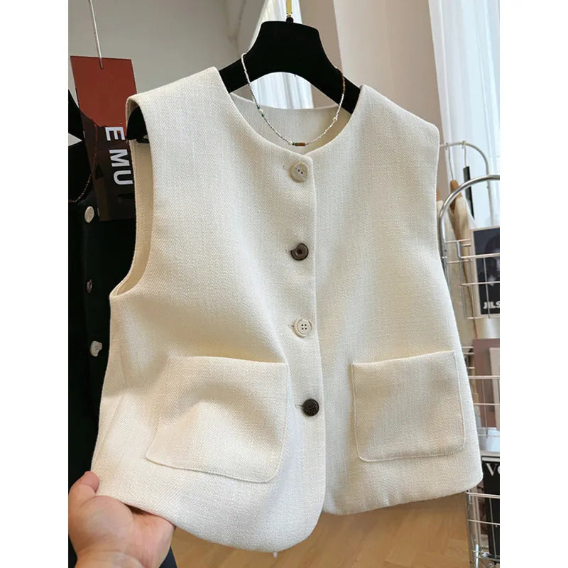 Women's round neck sleeveless vest in a fitted bandage dress style, shown in milky white.
