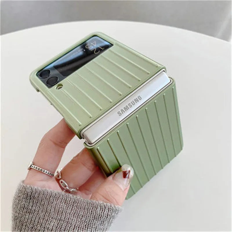 Ultra-thin black flip phone case for Samsung Z Flip3 folding mobile on a table.
