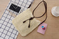 Handmade crochet crossbody straw bag for children with cotton lining in khaki colour