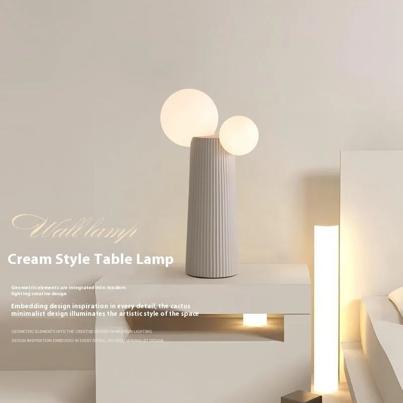 Modern minimalist cactus bedside lamp in milk coffee colour, resin and PE lampshade, 21cm diameter 40cm height, on bedside table