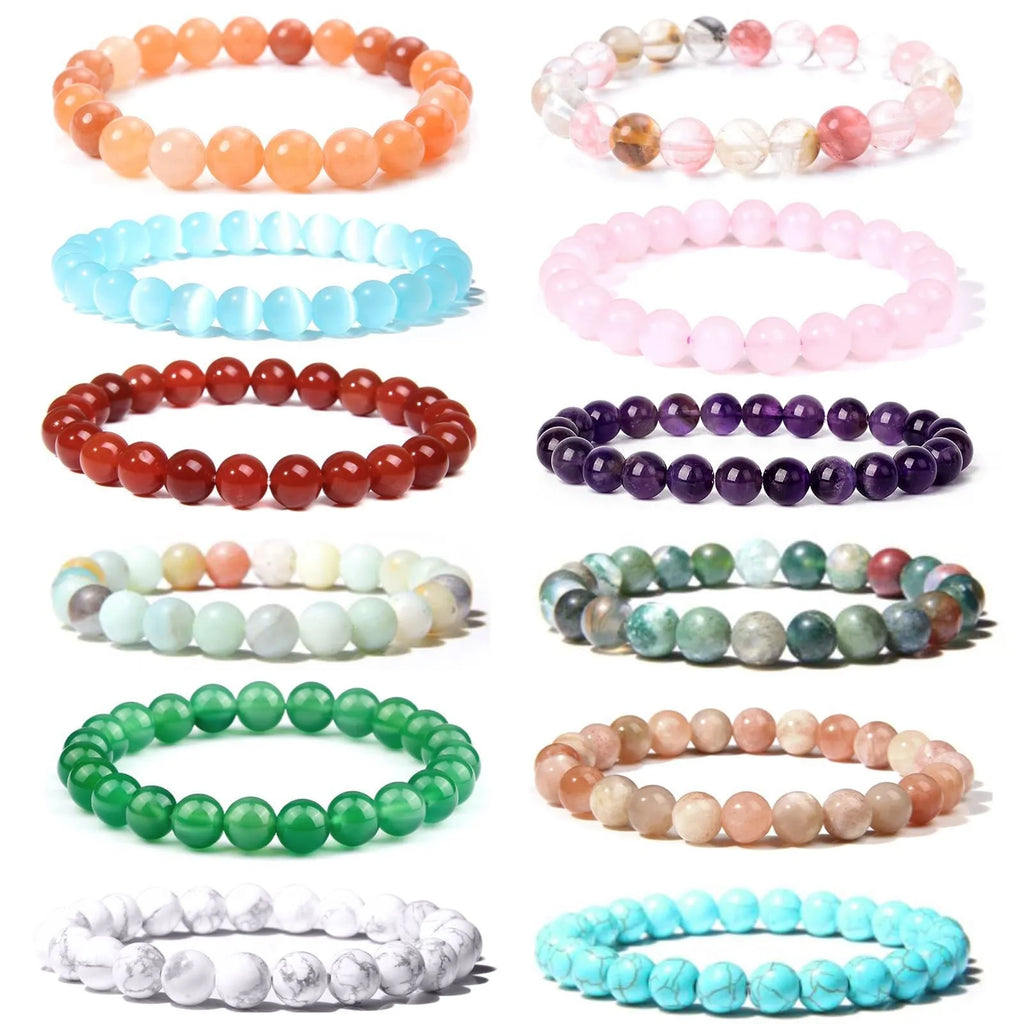 Close-up of a handmade bracelet with round 8mm agate beads in various natural stone colours on a wrist.