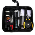 Black plastic and metal guitar repair tool kit for guitars, basses, mandolins, and banjos.