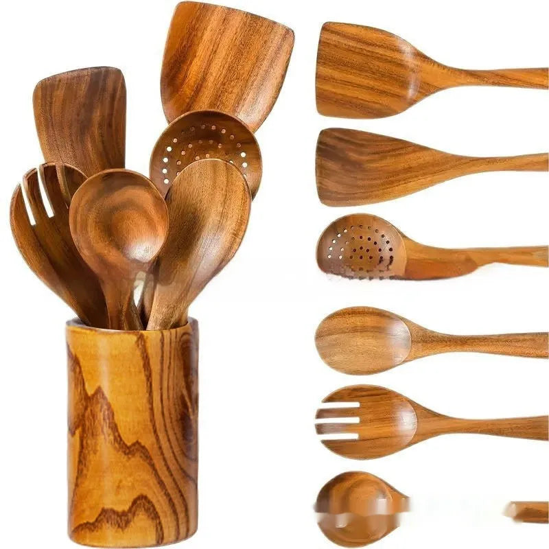 A set of seven wooden kitchen utensils including a spoon, a spatula, and several soup spoons laid out together.