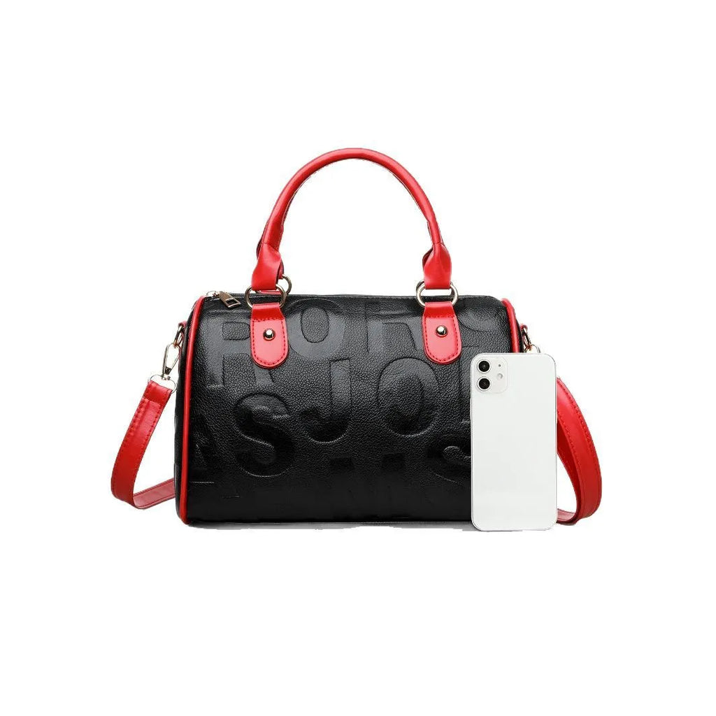 Cylindrical brown PU crossbody bag with three shoulder straps showing textured interior lining