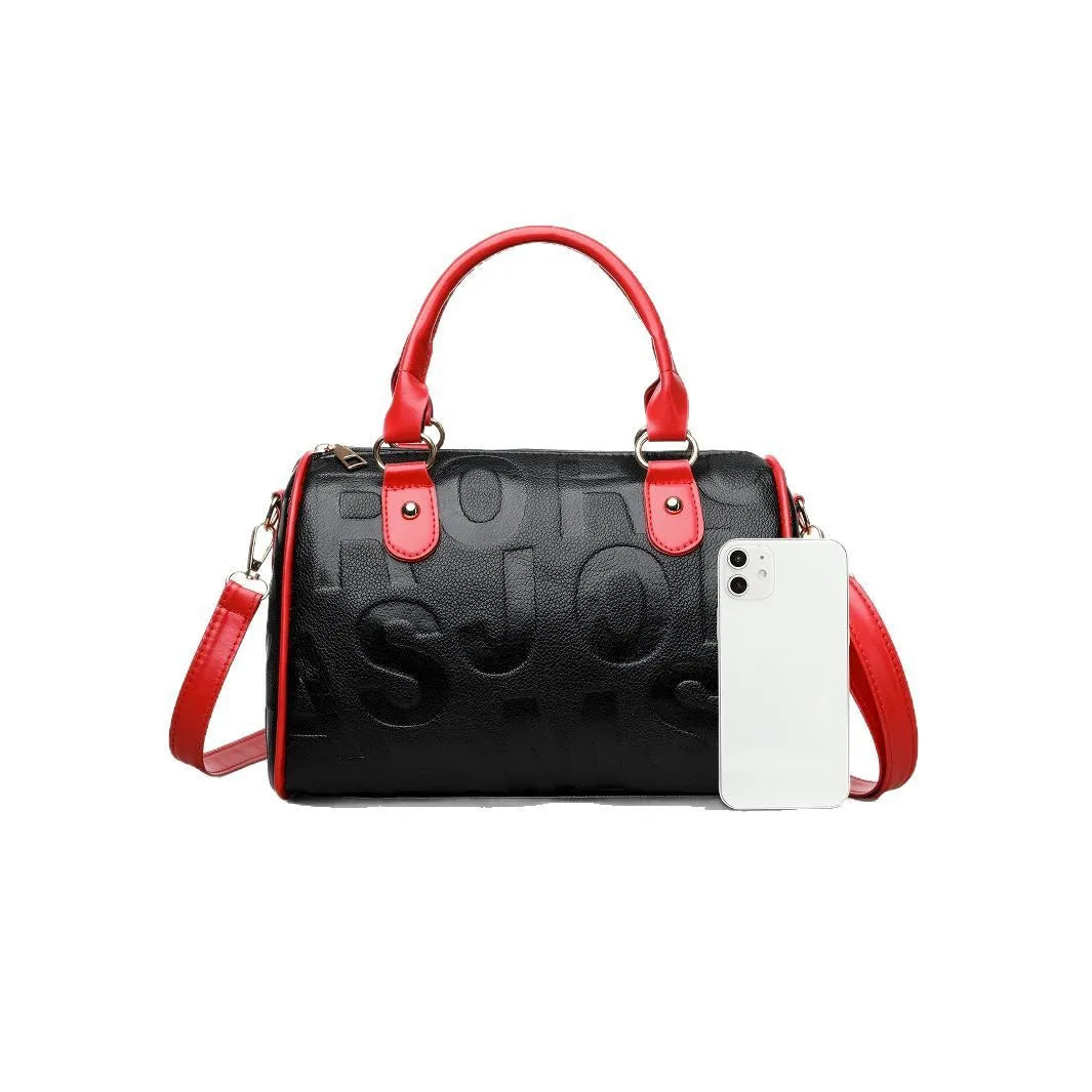 Cylindrical brown PU crossbody bag with three shoulder straps showing textured interior lining