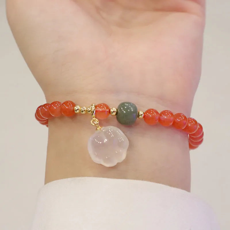 Women's natural red agate bracelet with 8mm cat's paw charms and complementary jade bracelet
