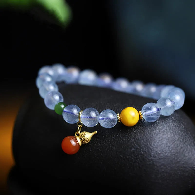 Women's aquamarine crystal bracelet with 8mm geometric beads in transparent iced blue colour