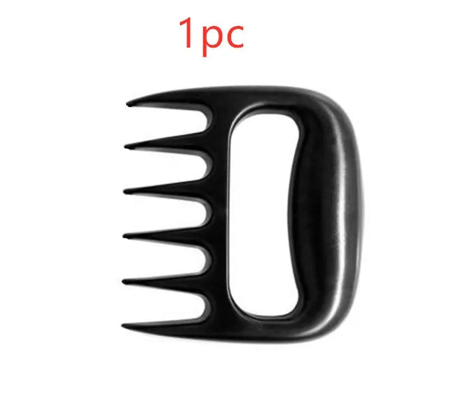 Two black bear claw meat shredder forks with paw patterns for barbecue meat preparation