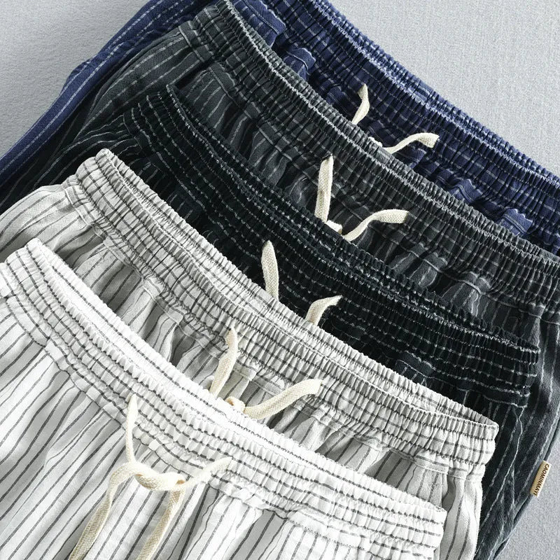 Men's striped cotton casual shorts with elastic waistband in light blue colour showing straight leg cut
