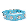 Decorative black dog collar with rhinestone flower pattern and studs on soft PU leather.