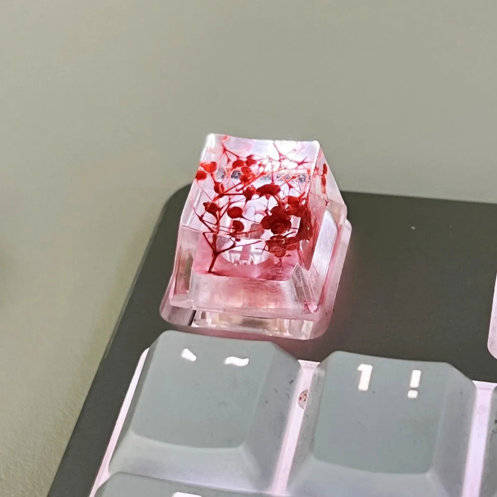 Transparent resin keycap with starry sky design in red, pink, green, or violet colours