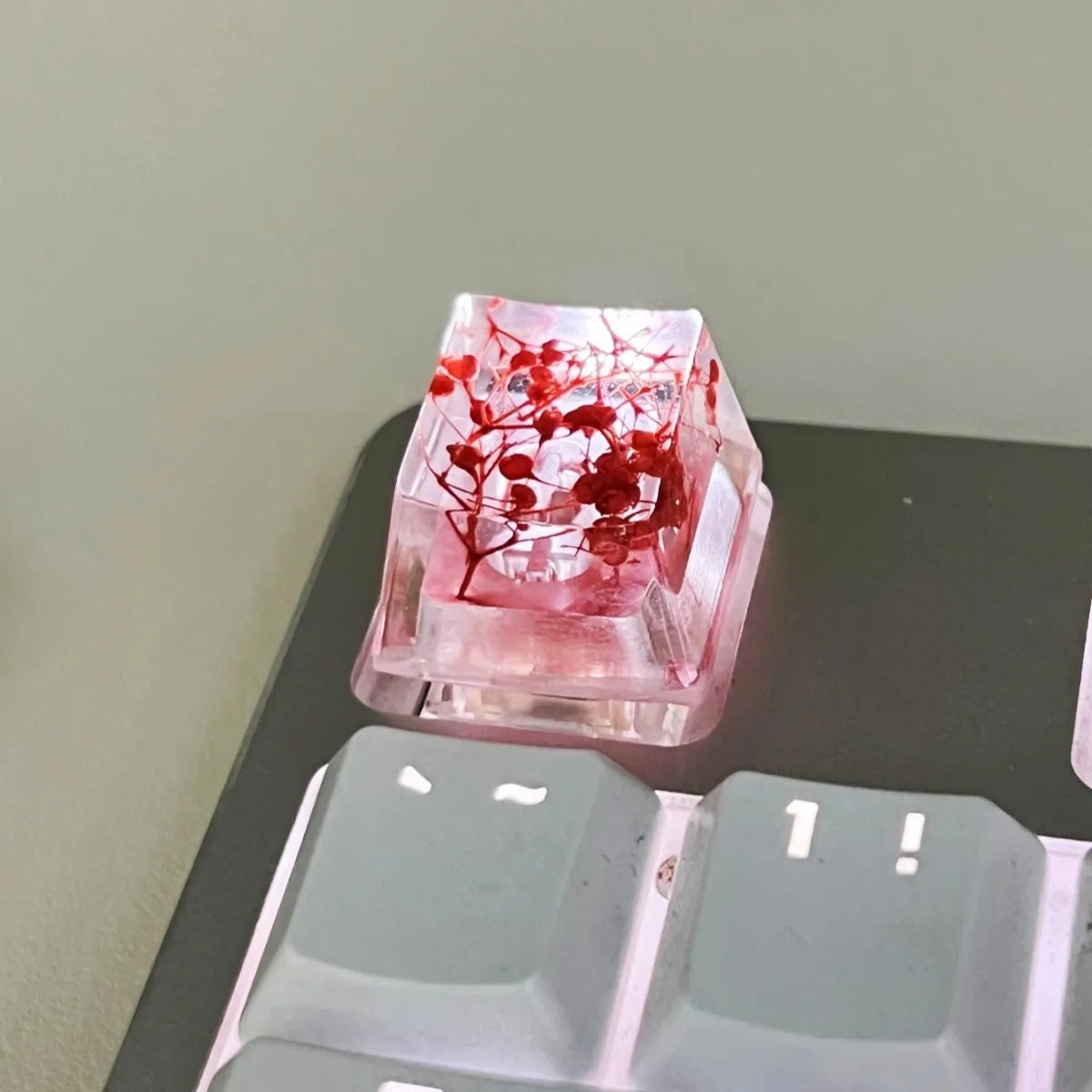 Transparent resin keycap with starry sky design in red, pink, green, or violet colours